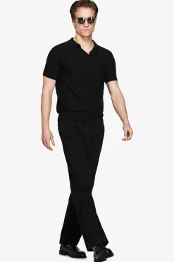 Polo in maglia traforata nera