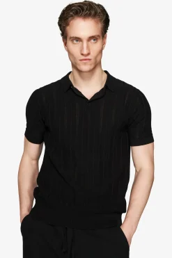 Polo in maglia traforata nera