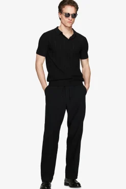 Polo in maglia traforata nera