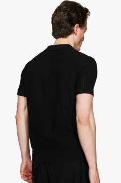 Polo in maglia traforata nera