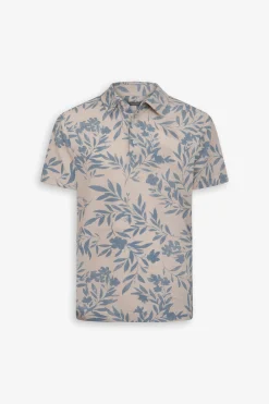 Polo in piquet fantasia fiore celeste