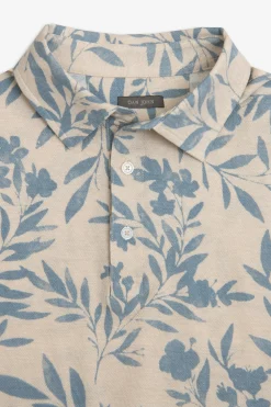 Polo in piquet fantasia fiore celeste